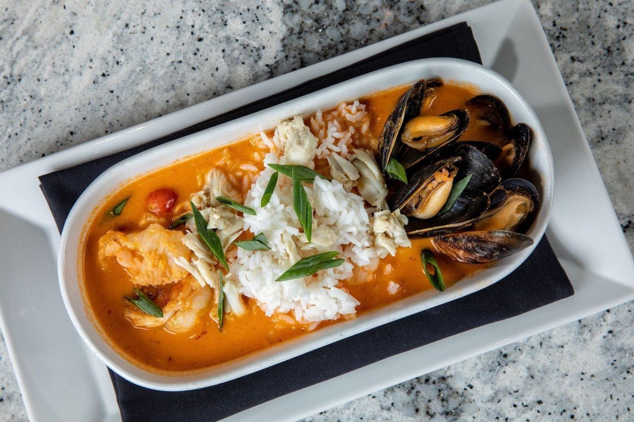 A seafood dish with mussels and rice at The Bay House